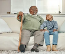Grandson and grandfather laughing together